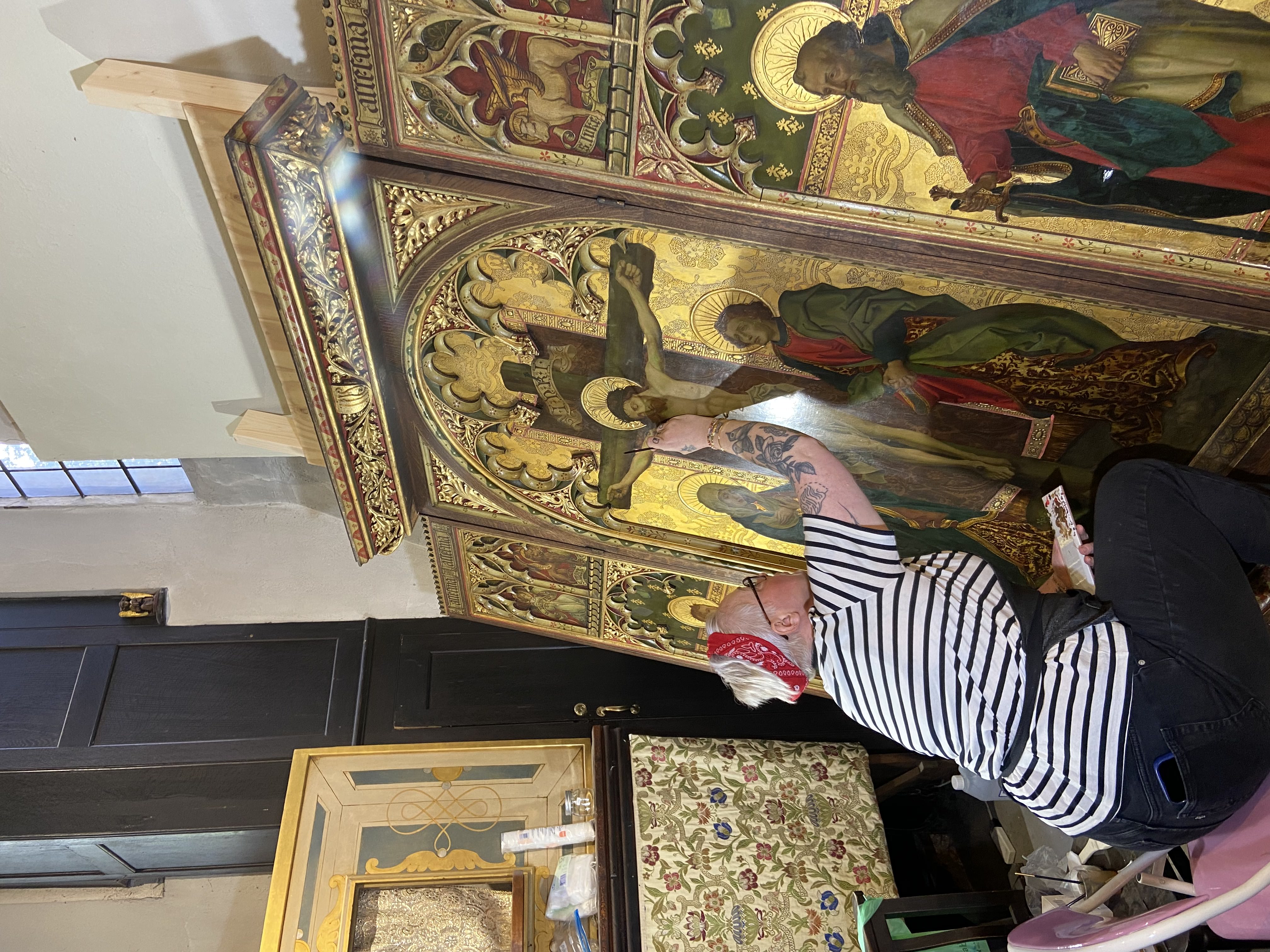 Cleaning and retouching a large reredos panel